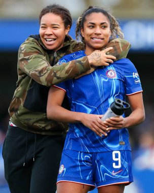 Mia Fishel and Catarina Macario celebrate after the teams victory following the Barclays Women's Super League match Chelsea FC Women vs Manchester United Women at Kingsmeadow Stadium, Kingston upon Thames, United Kingdom, 24th November 2024 clipart