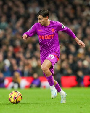 Rodrigo Gomes of Wolverhampton Wanderers breaks with the ball during the Premier League match Fulham vs Wolverhampton Wanderers at Craven Cottage, London, United Kingdom, 23rd November 2024 clipart