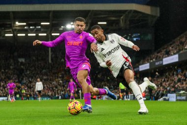 Andre of Wolverhampton Wanderers battles for the ball with Reiss Nelson of Fulham during the Premier League match Fulham vs Wolverhampton Wanderers at Craven Cottage, London, United Kingdom, 23rd November 2024 clipart