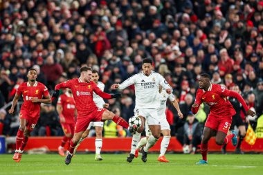 Alexis Mac Allister of Liverpool battles for the ball with Jude Bellingham of Real Madrid during the UEFA Champions League, League Phase MD5 Liverpool v Real Madrid at Anfield, Liverpool, United Kingdom, 27th November 2024 clipart