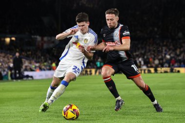 Sam Byram of Leeds United and Jordan Clark of Luton Town battle for the ball during the Sky Bet Championship match Leeds United vs Luton Town at Elland Road, Leeds, United Kingdom, 27th November 2024 clipart