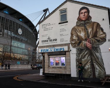 Liam Gallagher Stone Island mural across from the Etihad Stadium during the UEFA Champions League match Manchester City vs Feyenoord at Etihad Stadium, Manchester, United Kingdom, 26th November 2024 clipart