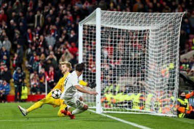 Caoimhin Kelleher of Liverpool makes a save Brahim Daz of Real Madrid during the UEFA Champions League, League Phase MD5 Liverpool v Real Madrid at Anfield, Liverpool, United Kingdom, 27th November 2024 clipart