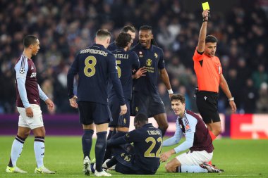 Pau Torres of Aston Villa is shown a yellow card by referee Jess Gil Manzano during the UEFA Champions League,League Phase MD5 match Aston Villa vs Juventus at Villa Park, Birmingham, United Kingdom, 27th November 2024 clipart