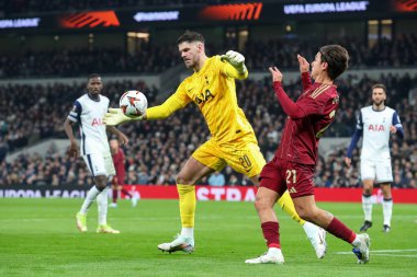 Fraser Forster of Tottenham Hotspur and Paulo Dybala of Roma battle for the ball during the UEFA Europa League - League Stage match Tottenham Hotspur vs A.S. Roma at Tottenham Hotspur Stadium, London, United Kingdom, 28th November 2024 clipart