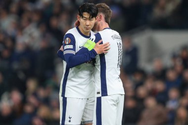 Son Heung-Min of Tottenham Hotspur speaks to James Maddison of Tottenham Hotspur after puts the captains armband on during the UEFA Europa League - League Stage match Tottenham Hotspur vs A.S. Roma at Tottenham Hotspur Stadium, London clipart