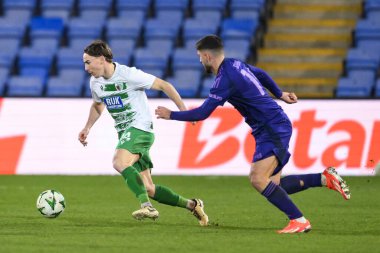 Dan Williams of The New Saints F.C. makes a break with the ball  during the UEFA Conference League - League Stage match The New Saints vs Djurgrden at Croud Meadow, Shrewsbury, United Kingdom, 28th November 2024 clipart