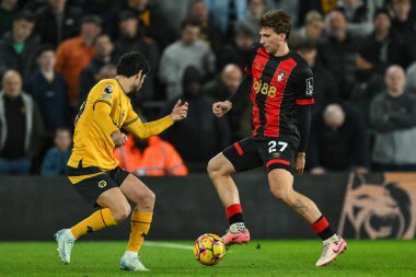 Illya Zabarnyi of Bournemouth takes on Gonalo Guedes of Wolverhampton Wanderers during the Premier League match Wolverhampton Wanderers vs Bournemouth at Molineux, Wolverhampton, United Kingdom, 30th November 2024 clipart