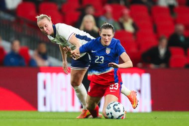 Emily Fox of United States is challenged by Beth Mead of England during the Women's International Friendly match England vs United States at Wembley Stadium, London, United Kingdom, 30th November 2024 clipart