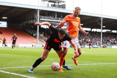 Jordan Rhodes of Blackpool tackles Krystian Bielik of Birmingham City during the Emirates FA Cup 2nd Round match Blackpool vs Birmingham City at Bloomfield Road, Blackpool, United Kingdom, 1st December 2024 clipart