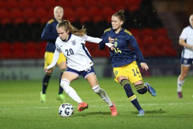 Sarah Brasero of England Women U23 holds off My Cato of Sweden U23 during the Women's International Friendly match England Women U23 vs Sweden women U23 at Eco-Power Stadium, Doncaster, United Kingdom, 2nd December 2024 clipart