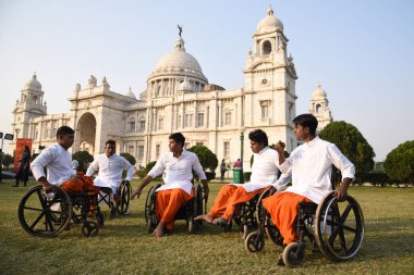 Physically challenged artists on a handicapped tricycle troupe perform Dance on Wheels, Infront of the Kolkata iconic Victoria Memorial Hall ,Organised by the Kolkata Centr for Creativity in collaboration with Victoria Memorial Hall,in Kolkata,India clipart