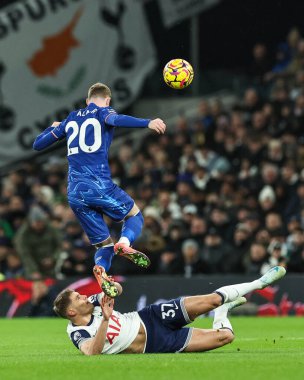 Cole Palmer of Chelsea is tackled by Micky van de Ven of Tottenham Hotspur during the Premier League match Tottenham Hotspur vs Chelsea at Tottenham Hotspur Stadium, London, United Kingdom, 8th December 2024 clipart