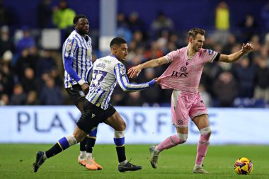 Sheffield 'den Yan Valery Çarşamba günü Blackburn Rovers' dan Ryan Hedges 'in gömleğini aldı. 10 Aralık 2024' te Hillsborough, Sheffield, Birleşik Krallık 'ta Çarşamba günü Blackburn Rovers' a karşı oynanan Gökyüzü İddia Şampiyonası maçında.