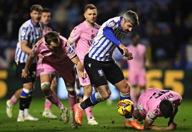 Danny Batth of Blackburn Rovers defends against Callum Paterson of Sheffield Wednesday during the Sky Bet Championship match Sheffield Wednesday vs Blackburn Rovers at Hillsborough, Sheffield, United Kingdom, 10th December 2024 clipart