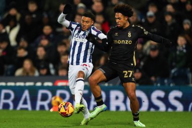 West Bromwich Albion 'dan Lewis Dobbin ve Coventry City' den Milan van Ewijk, 11 Aralık 2024 'te The Hawthorns, West Bromwich, İngiltere' de oynanan Sky Bet Şampiyonası maçında top için mücadele ediyorlar.