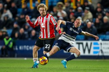 Tom Davies of Sheffield United battles for the ball with Casper de Norre of Millwall during the Sky Bet Championship match Millwall vs Sheffield United at The Den, London, United Kingdom, 11th December 2024 clipart