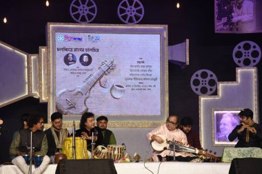 Indian Musician Tejendra Majumdar and Tanmoy Bose performing at the 30th Kolkata International Film Festival in Kolkata,India on December 9,2024  clipart