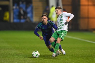 Josh Daniels of The New Saints F.C. passes the ball during the UEFA Conference League - League Stage The New Saints v Panathinaikos at Croud Meadow, Shrewsbury, United Kingdom, 12th December 2024 clipart