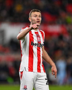 Ben Gibson of Stoke City gives his team instructions during the Sky Bet Championship match Stoke City vs Cardiff City at Bet365 Stadium, Stoke-on-Trent, United Kingdom, 14th December 2024 clipart