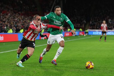 Sheffield United takımından Jamie Shackleton, Sheffield Lane, Sheffield, Birleşik Krallık 'ta 14 Aralık 2024' te oynanan Sky Bet Şampiyonası maçında Plymouth Argyle 'a karşı Plymouth maçında Plymouth Argyle' a meydan okuyor.