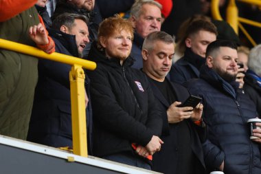 Ipswich Town taraftarı ve hissedar Ed Sheeran, 14 Aralık 2024 tarihinde İngiltere 'de Molineux, Wolverhampton' da oynanan Premier League maçında Wolverhampton Wanderers Ipswich Town 'a karşı.