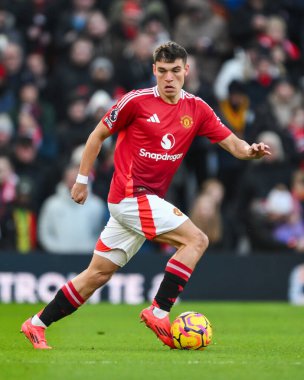 Manuel Ugarte of Manchester United makes a break with the ball during the Premier League match Manchester United vs Bournemouth at Old Trafford, Manchester, United Kingdom, 22nd December 2024 clipart