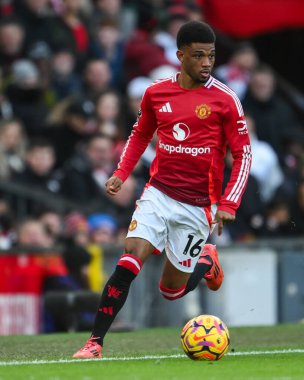 Amad Diallo of Manchester United makes a break with the ball during the Premier League match Manchester United vs Bournemouth at Old Trafford, Manchester, United Kingdom, 22nd December 2024 clipart