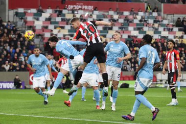 Kristoffer Ajer of Brentford has a headed shot at goal during the Premier League match Brentford vs Nottingham Forest at The Gtech Community Stadium, London, United Kingdom, 21st December 2024 clipart