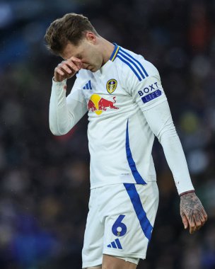 Joe Rodon of Leeds United rubs his head after receiving treatment during the Sky Bet Championship match Leeds United vs Oxford United at Elland Road, Leeds, United Kingdom, 21st December 2024 clipart