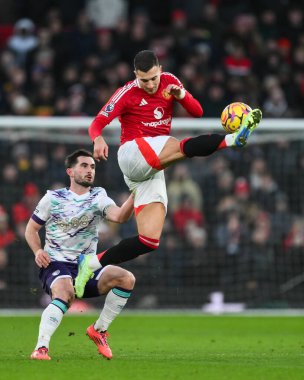 Diogo Dalot of Manchester United clears the ball during the Premier League match Manchester United vs Bournemouth at Old Trafford, Manchester, United Kingdom, 22nd December 2024 clipart