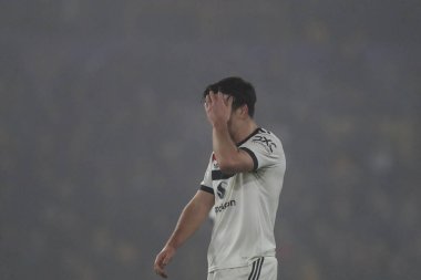 Manchester United takımından Harry Maguire, Premier League maçında Wolverhampton Wanderers 'ın Manchester United' a karşı Molineux, Wolverhampton, Birleşik Krallık 'ta 26 Aralık 2024' te oynadığı maçta 2-0 yenilgiyi kabul etti.