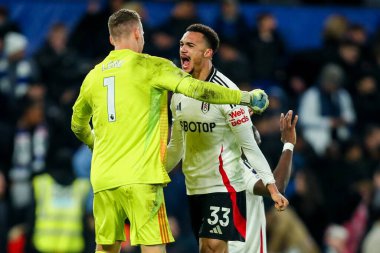 Bernd Leno and Antonee Robinson of Fulham celebrate after the teams victory following the Premier League match Chelsea vs Fulham at Stamford Bridge, London, United Kingdom, 26th December 2024 clipart