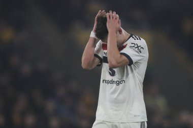Manchester United 'dan Manuel Ugarte, 26 Aralık 2024' te İngiltere 'nin Molineux kentinde oynanan Premier League karşılaşmasında Wolverhampton Wanderers ile Manchester United maçında tepki gösterdi.