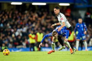 Chelsea 'li Cole Palmer, 26 Aralık 2024' te Stamford Bridge, Londra 'da oynanan Premier League karşılaşmasında Fulham' lı Sasa Lukiç 'e meydan okudu.