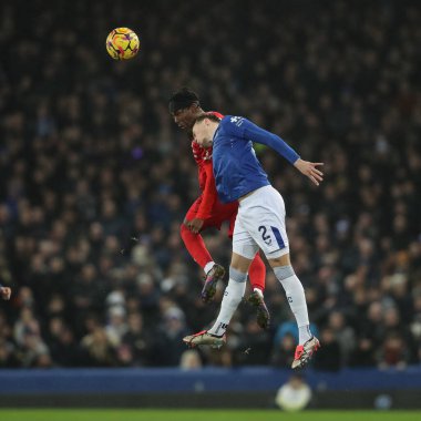 Anthony Elanga of Nottingham Forest jumps up to win the high ball from Nathan Patterson of Everton during the Premier League match Everton vs Nottingham Forest at Goodison Park, Liverpool, United Kingdom, 29th December 2024 clipart