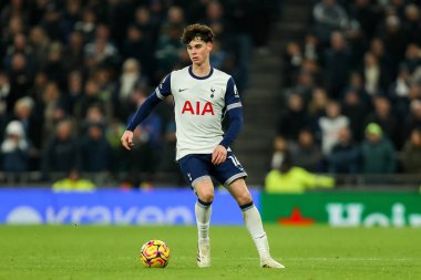 Archie Gray of Tottenham Hotspur runs with the ball during the Premier League match Tottenham Hotspur vs Wolverhampton Wanderers at Tottenham Hotspur Stadium, London, United Kingdom, 29th December 2024 clipart