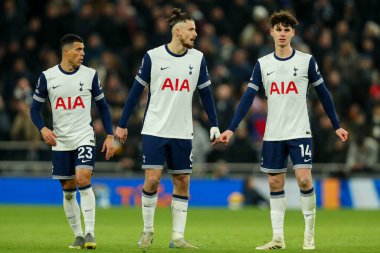 Pedro Porro, Radu Drguin and Archie Gray of Tottenham Hotspur look on during the Premier League match Tottenham Hotspur vs Wolverhampton Wanderers at Tottenham Hotspur Stadium, London, United Kingdom, 29th December 2024 clipart