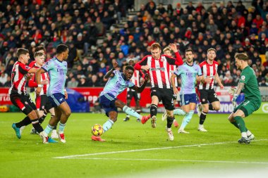 Arsenal oyuncusu Thomas, 1 Ocak 2024 'te İngiltere' deki Gtech Community Stadyumu 'nda oynanan Premier League maçında Brentford' a karşı Arsenal 'i vurdu.