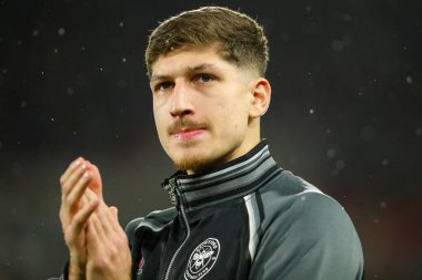 Vitaly Janelt of Brentford acknowledges the fans prior to the Premier League match Brentford vs Arsenal at The Gtech Community Stadium, London, United Kingdom, 1st January 2024 clipart