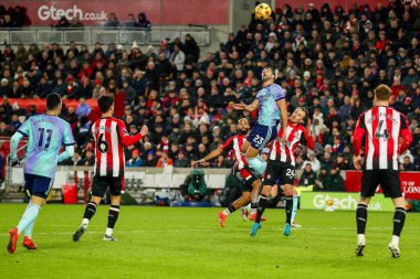 Mikel Merino of Arsenal heads the ball during the Premier League match Brentford vs Arsenal at The Gtech Community Stadium, London, United Kingdom, 1st January 2024 clipart