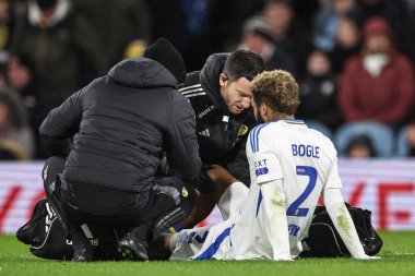 Jayden Bogle of Leeds United receives treatment during the Sky Bet Championship match Leeds United vs Blackburn Rovers at Elland Road, Leeds, United Kingdom, 1st January 2024 clipart