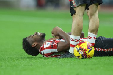 Aji Alese of Sunderland goes down during the Sky Bet Championship match Sunderland vs Sheffield United at Stadium Of Light, Sunderland, United Kingdom, 1st January 202 clipart