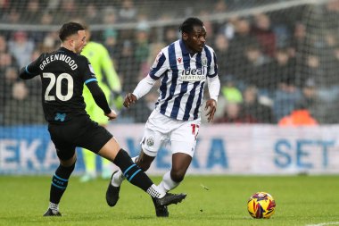 Preston North End 'den Sam Greenwood, West Bromwich Albion' dan Ousmane Diakit Sky Bet Şampiyonası 'nda West Bromwich Albion, Preston North End' e karşı Hawthorns, West Bromwich, Birleşik Krallık 'ta 1 Ocak 2024' te oynanan karşılaşmada faul yaptı.