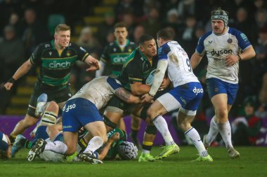 Juarno Augustus of Northampton Saints is tackled by Ben Spencer of Bath Rugby during the Gallagher Premiership match Northampton Saints vs Bath Rugby at Cinch Stadium at Franklin's Gardens, Northampton, United Kingdom, 5th January 2025 clipart