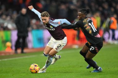 Matty Cash of Aston Villa breaks past Stephy Mavididi of Leicester City during the Premier League match Aston Villa vs Leicester City at Villa Park, Birmingham, United Kingdom, 4th January 2024 clipart