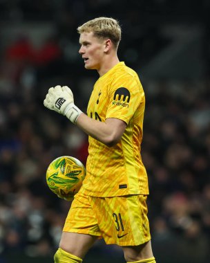 Antonin Kinsky of Tottenham Hotspur in action with the ball during the Carabao Cup Semi-Finals First Leg Tottenham Hotspur vs Liverpool at Tottenham Hotspur Stadium, London, United Kingdom, 8th January 2025 clipart