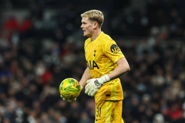 Antonin Kinsky of Tottenham Hotspur in action with the ball during the Carabao Cup Semi-Finals First Leg Tottenham Hotspur vs Liverpool at Tottenham Hotspur Stadium, London, United Kingdom, 8th January 2025 clipart