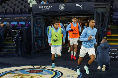 Nathan Ak of Manchester City comes out for the pre-game warmup ahead of the Emirates FA Cup 3rd Round match Manchester City vs Salford City at Etihad Stadium, Manchester, United Kingdom, 11th January 2025 clipart