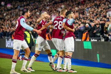 Carlos Soler of West Ham United celebrates his goal with teammates to make it 1-0 during the Premier League match West Ham United vs Fulham at London Stadium, London, United Kingdom, 14th January 2025 clipart